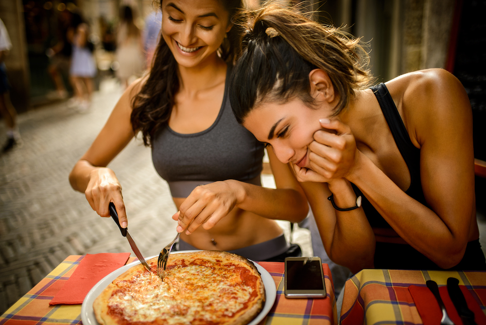 SPORTY-WOMEN-ENJOYING-PIZZA-copy